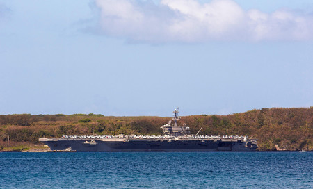 １０日、米領グアムの海軍基地に停泊する空母「セオドア・ルーズベルト」（ＡＦＰ時事）